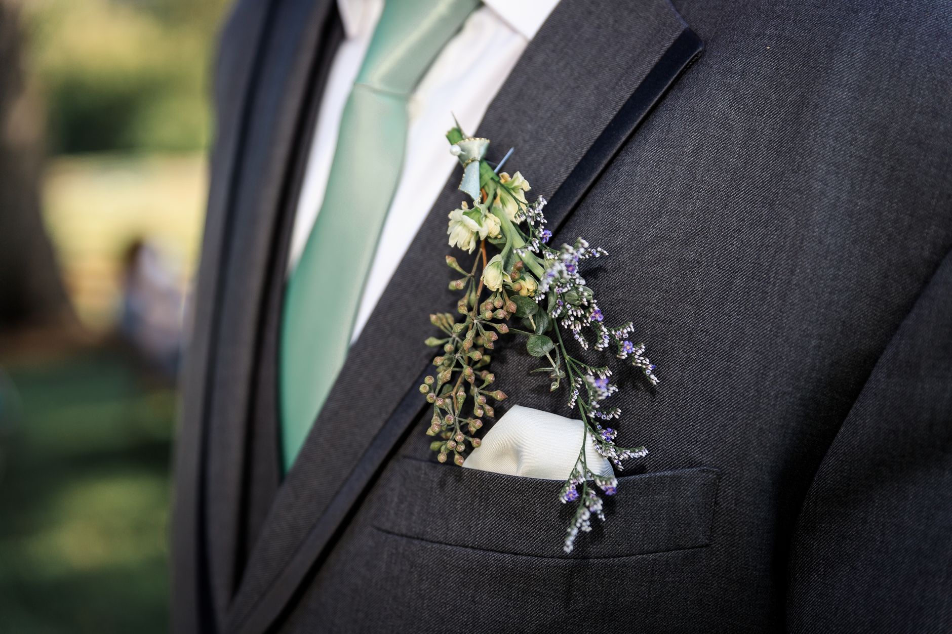 Detail shot of a tailored jacket lapel construction showing fabric and roll point