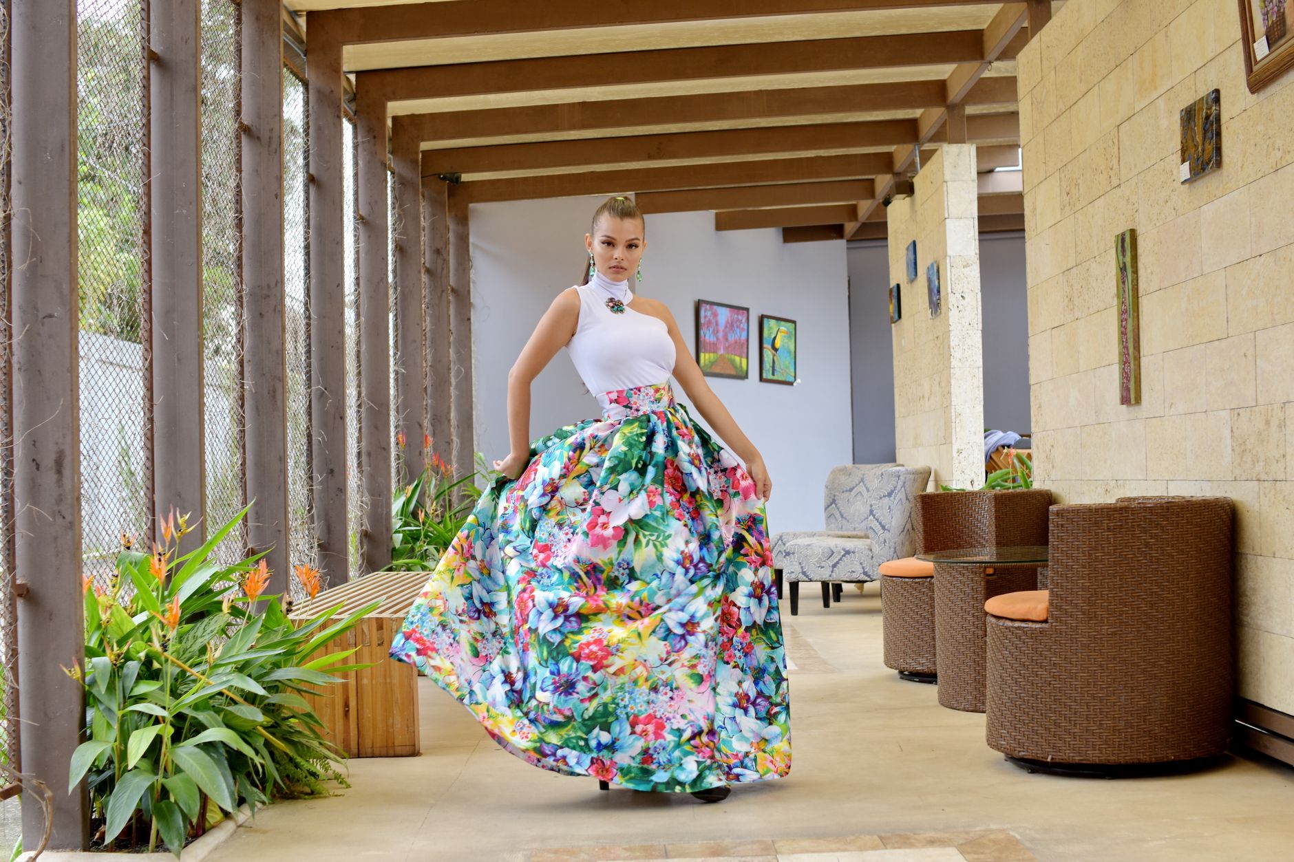 Fashion model wearing an architectural structured skirt with defined hip panels and vertical pleating