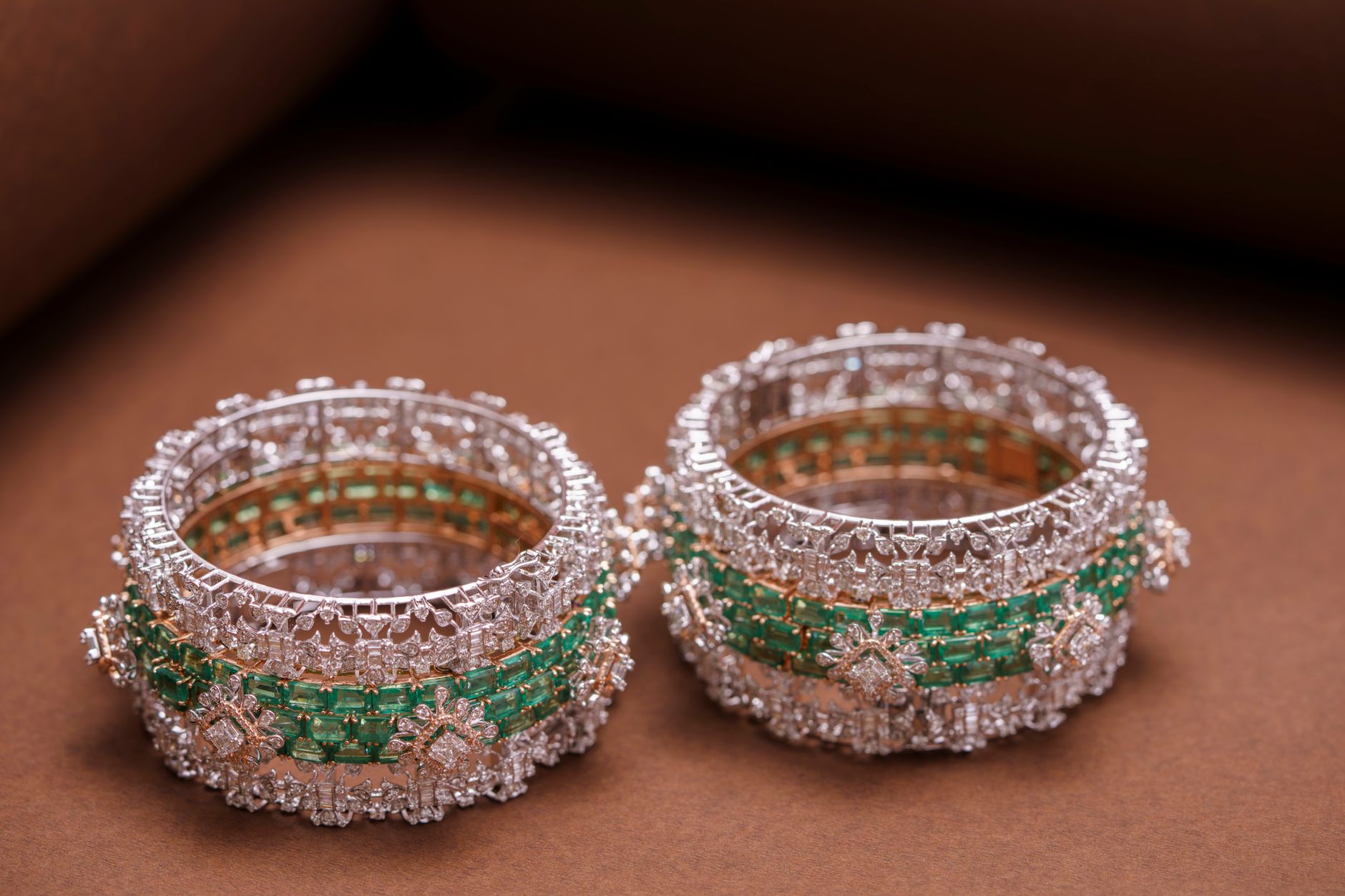 Heavy round-profile silver bangles displayed on a neutral surface showing structured wire construction