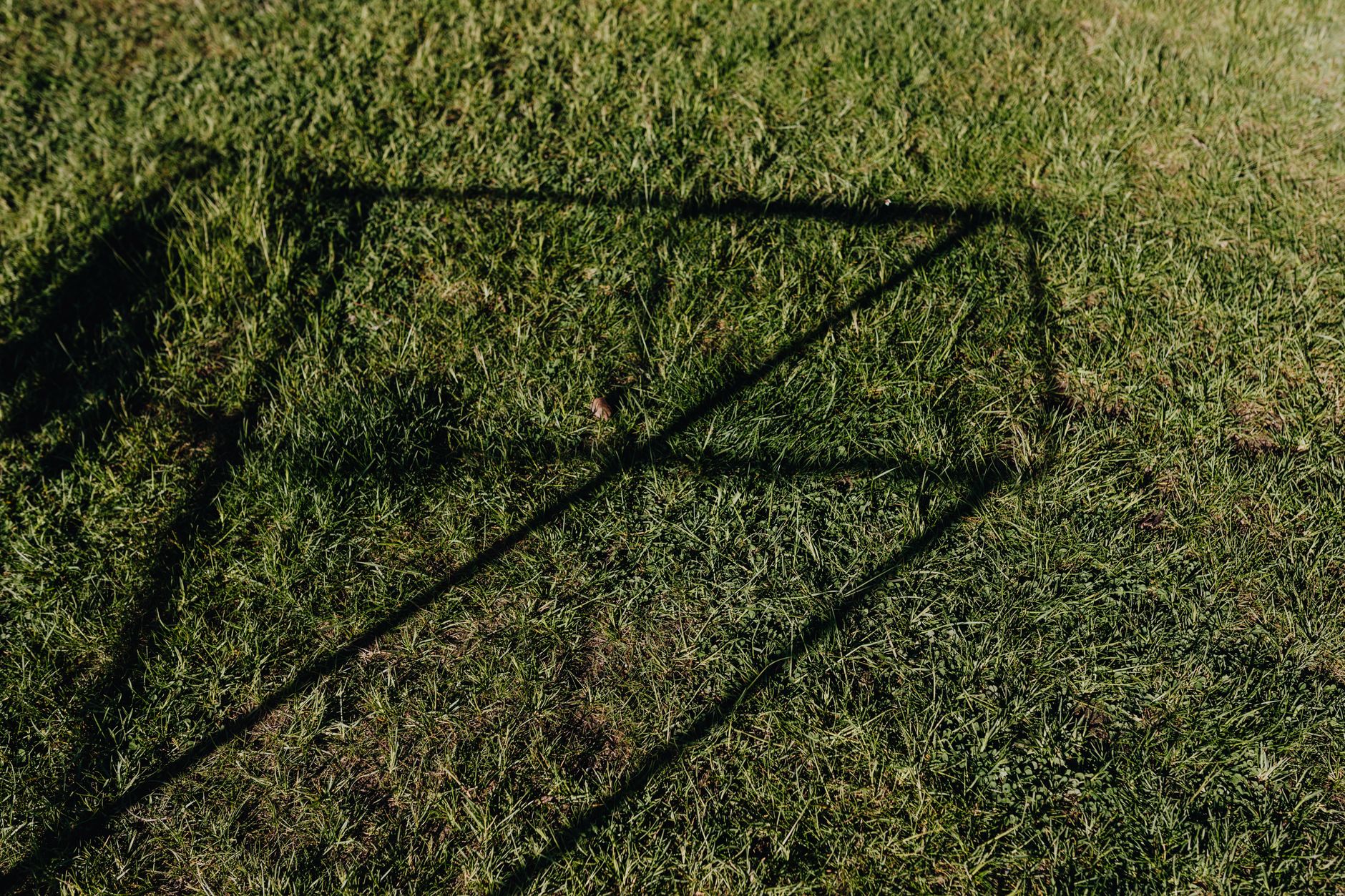 A formal croquet lawn showing white boundary string lines marking the court edges on green grass