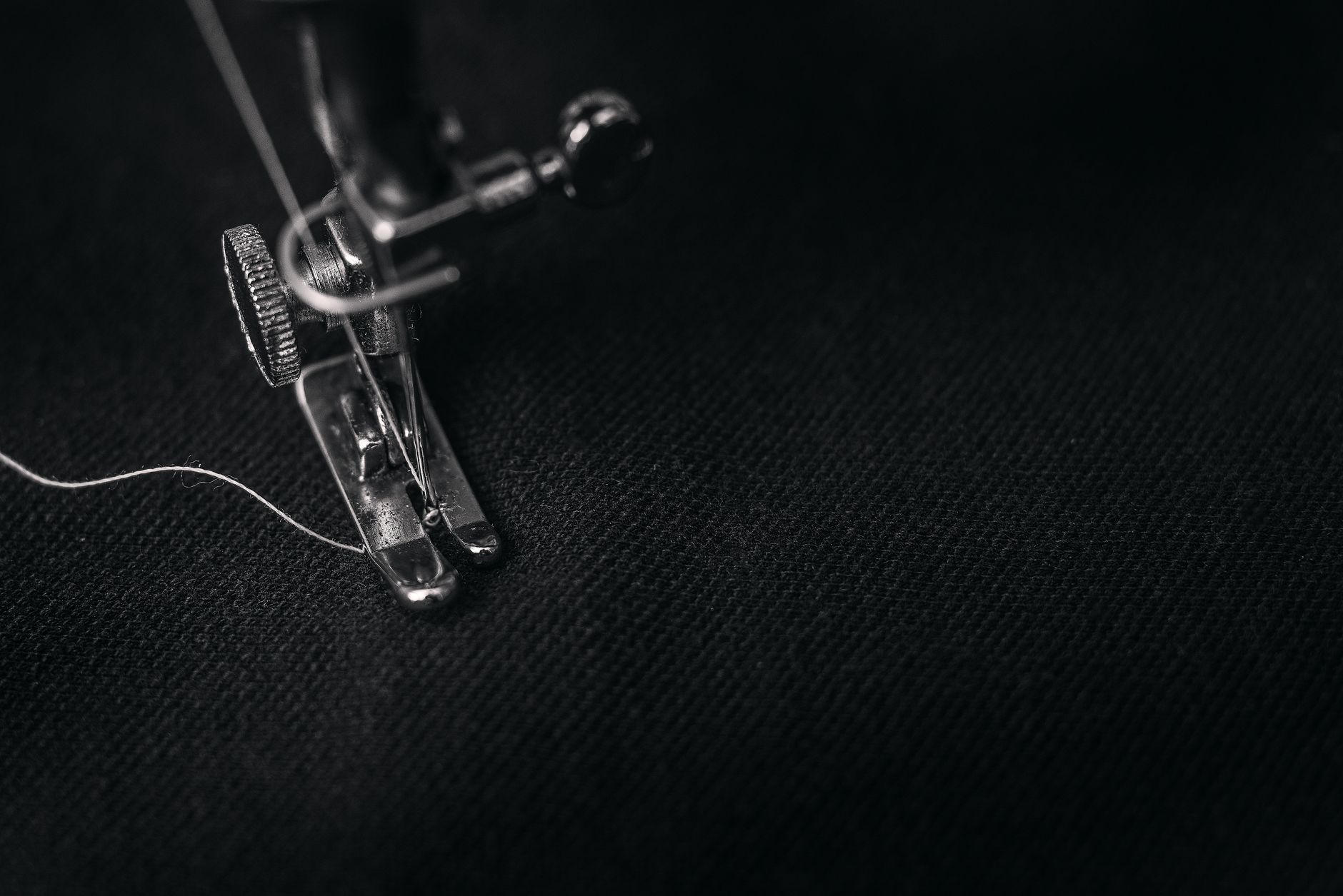 Detail of fine collar stitching on a delicate fabric blouse during construction