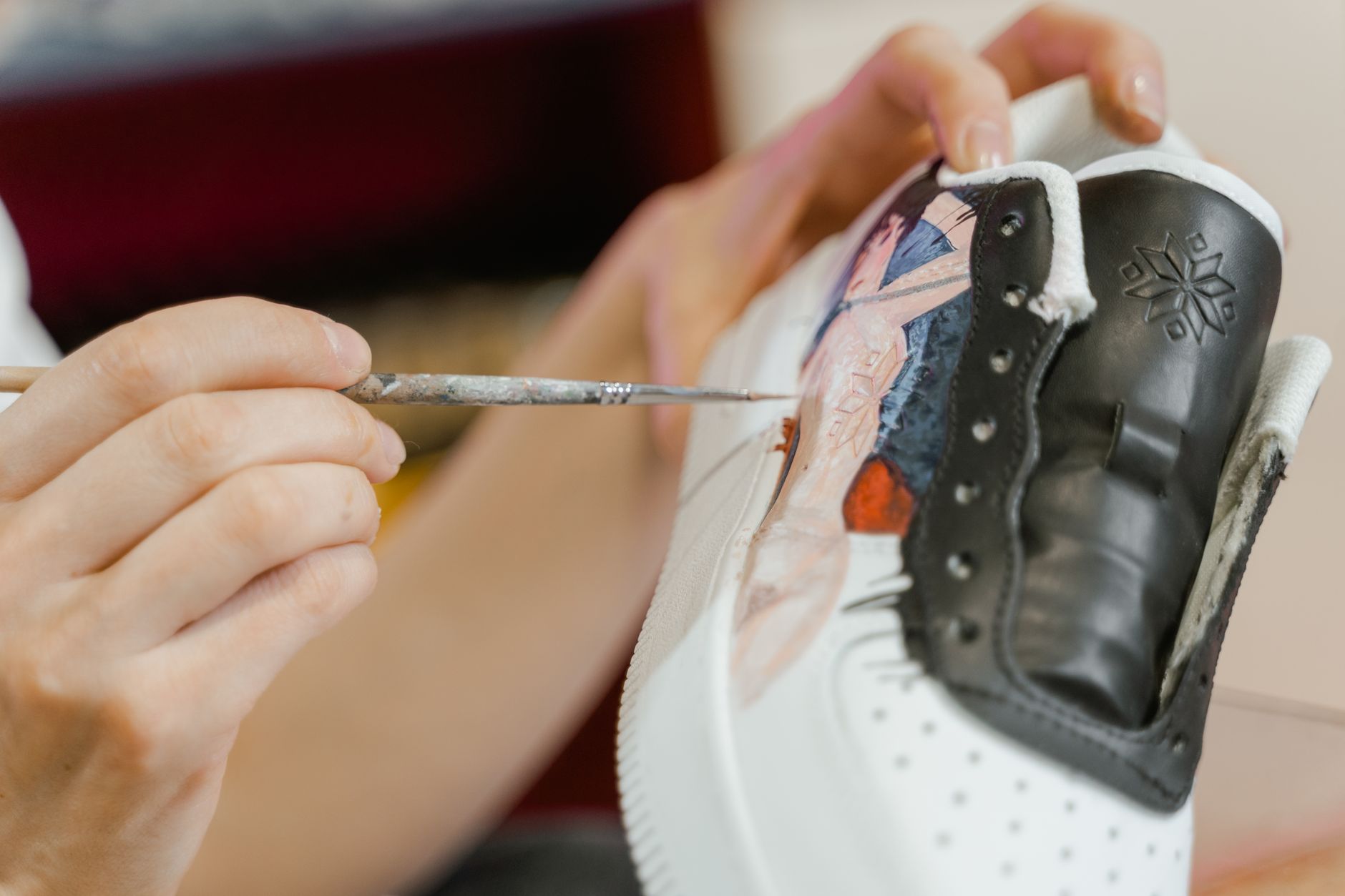 Footwear design workspace with structured shoe prototypes displayed on a clean surface