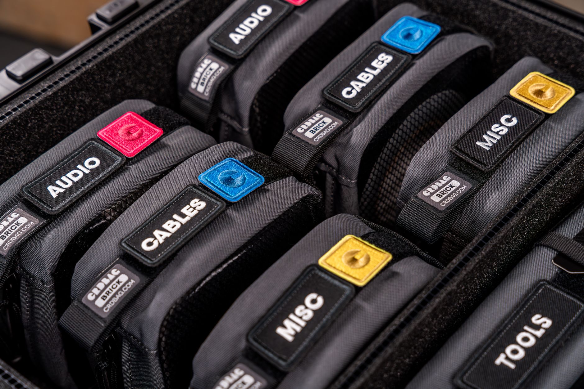 Close-up of metal edge hardware along the base of a structured accessory bag