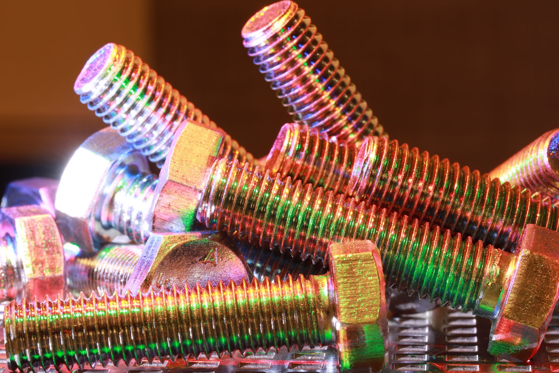 Matte stainless metal clips and fasteners arranged on a neutral surface