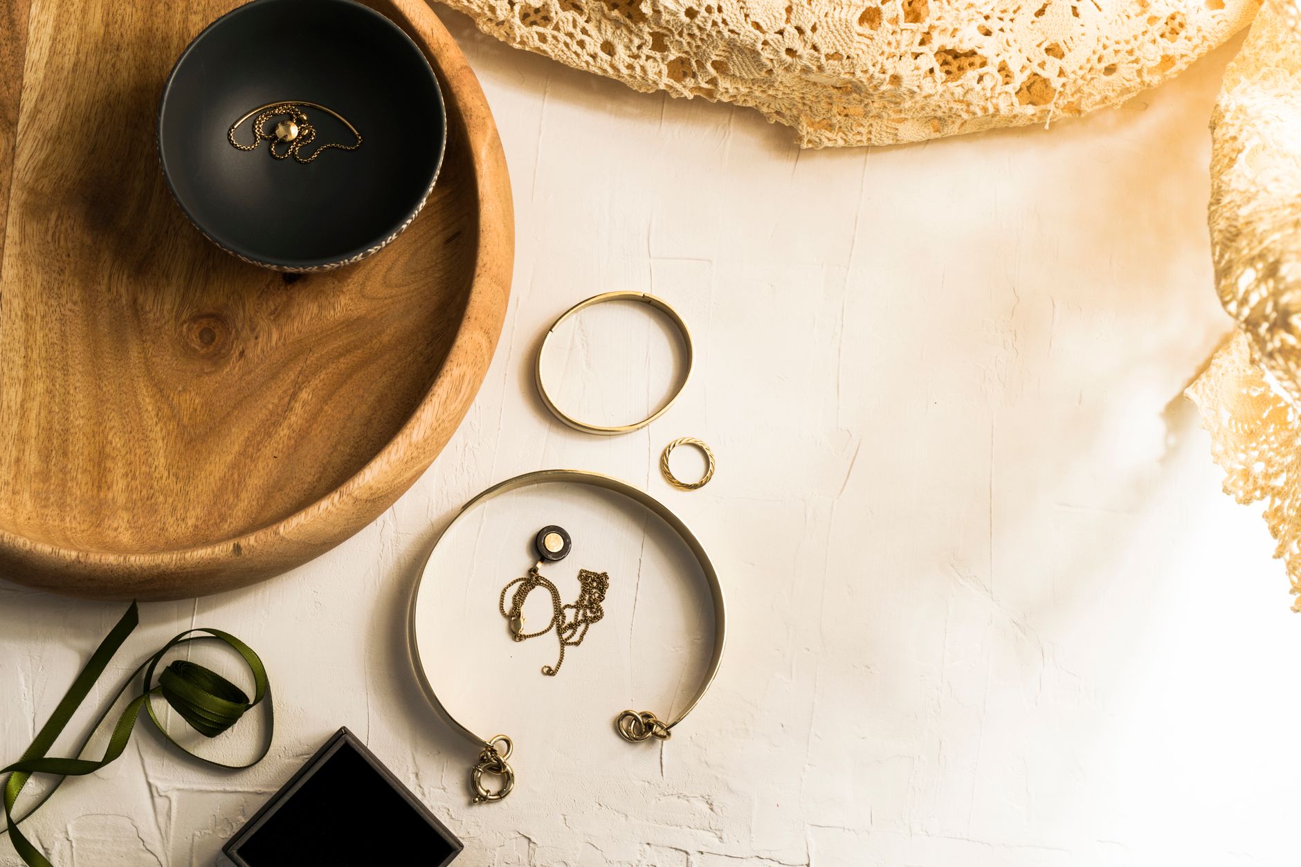 Flat lay of minimalist cord accessories arranged on a neutral surface